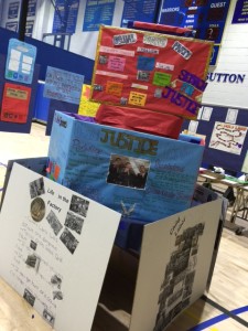 Sophomores in history class created political parties based on horrific working conditions in the 19th century. This "tower of justice" is "based" on problems such as unfair wage conditions and unsafe working conditions.