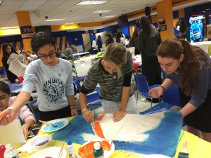 Part of the fun of the PBL days is that everyone gets a chance to get creative -- even the teachers. In the center there is Mrs. Roxanne Maleh, one of the school's English teachers.